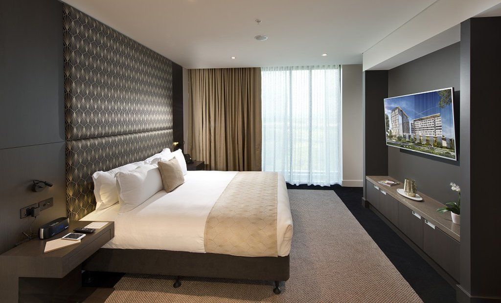 Pullman Brisbane Airport Hotell Exteriör bild A bedroom at the hotel